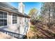 Rear view of house showing siding and wooded area at 2770 Stony Place Ct, Grayson, GA 30017