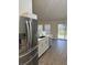 Modern kitchen with stainless steel appliances and white cabinets at 2770 Stony Place Ct, Grayson, GA 30017