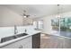 Kitchen with white cabinets, quartz countertops and deck access at 2770 Stony Place Ct, Grayson, GA 30017