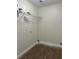 Laundry room with wire shelving and light wood flooring at 2770 Stony Place Ct, Grayson, GA 30017