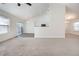 Open living room with vaulted ceiling and carpet at 2770 Stony Place Ct, Grayson, GA 30017