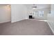 Spacious living room with fireplace and carpet flooring at 2770 Stony Place Ct, Grayson, GA 30017