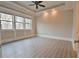 Light and airy bedroom with hardwood floors and a ceiling fan at 4821 Josie Way, Acworth, GA 30101