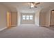 Bonus room featuring carpet, ceiling fan and large window at 4821 Josie Way, Acworth, GA 30101