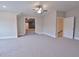 Bonus room with carpet, ceiling fan and access to other rooms at 4821 Josie Way, Acworth, GA 30101