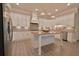 Modern kitchen with white cabinetry, granite countertops, and stainless steel appliances at 4821 Josie Way, Acworth, GA 30101