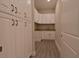 Bright laundry room with white cabinets and granite countertop at 4821 Josie Way, Acworth, GA 30101