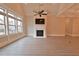 Open living room with hardwood floors, fireplace, and large windows at 4821 Josie Way, Acworth, GA 30101