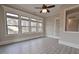 Sunroom with hardwood floors, multiple windows, and ceiling fan at 4821 Josie Way, Acworth, GA 30101