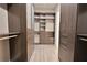 Spacious walk-in closet with built-in shelves and drawers at 4821 Josie Way, Acworth, GA 30101