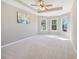 Large bedroom with bay windows and ceiling fan at 575 Maple Crest Dr, Lawrenceville, GA 30044