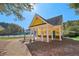 Community building with columns, yellow walls, green trim at 575 Maple Crest Dr, Lawrenceville, GA 30044