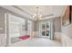 Formal dining room with chandelier and wainscoting at 575 Maple Crest Dr, Lawrenceville, GA 30044