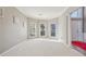 Sun-filled sitting area with bay windows and carpeted floors at 575 Maple Crest Dr, Lawrenceville, GA 30044