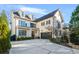 Two-story house with a front porch, driveway, and landscaping at 2619 Green Meadows Ln, Brookhaven, GA 30319