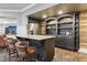 Basement wet bar with granite countertop and shelving at 335 Boundary Pl, Roswell, GA 30075