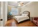 Charming bedroom with queen-size bed and hardwood floors at 335 Boundary Pl, Roswell, GA 30075