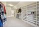 Spacious walk-in closet with custom built-ins and window at 335 Boundary Pl, Roswell, GA 30075