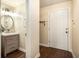 Modern powder room with a floating vanity and updated fixtures at 425 Abbeywood Dr, Roswell, GA 30075