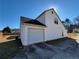 House exterior, white siding and attached garage at 916 Hunt Rd, Jonesboro, GA 30236