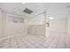 Finished basement featuring neutral walls, tile flooring, and a service ledge at 1379 Chatley Way, Woodstock, GA 30188