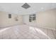 Finished basement features neutral walls, tile flooring, and windows for natural light at 1379 Chatley Way, Woodstock, GA 30188