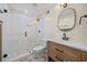 Modern bathroom with a glass-enclosed shower, new vanity, and updated fixtures at 1379 Chatley Way, Woodstock, GA 30188