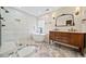 Bright bathroom with a soaking tub, glass enclosed shower, and patterned tile floors at 1379 Chatley Way, Woodstock, GA 30188