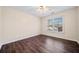 Cozy bedroom with wood-look floors and bright natural light at 1379 Chatley Way, Woodstock, GA 30188