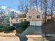 Two-story house with a two-car garage and manicured lawn at 1379 Chatley Way, Woodstock, GA 30188