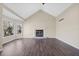 Bright living room with a fireplace, bay window, and hardwood floors at 1379 Chatley Way, Woodstock, GA 30188