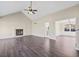 Inviting living room featuring a fireplace, vaulted ceiling, and hardwood floors at 1379 Chatley Way, Woodstock, GA 30188