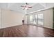 Spacious main bedroom features wood-look floors, a tray ceiling, and a bathroom entrance at 1379 Chatley Way, Woodstock, GA 30188