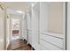 Walk-in closet with mirror and custom shelving at 1379 Chatley Way, Woodstock, GA 30188