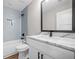 Bathroom with a shower-tub combo and a marble vanity at 321 Evie Ln, Canton, GA 30115