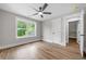 Bedroom with a ceiling fan, wood flooring, and trim at 321 Evie Ln, Canton, GA 30115