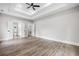 Primary bedroom with tray ceiling, ceiling fan and en suite bathroom at 321 Evie Ln, Canton, GA 30115