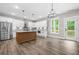 Modern kitchen includes a center island, stainless appliances, and plenty of natural light at 321 Evie Ln, Canton, GA 30115