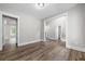 Spacious room with wood-look floors, large windows and craftsman trim at 321 Evie Ln, Canton, GA 30115