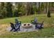 Relaxing backyard firepit with seating for four at 1252 Kingsview Se Cir, Smyrna, GA 30080