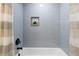 Bathroom with a shower/tub and gray tile at 1252 Kingsview Se Cir, Smyrna, GA 30080