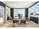 Elegant dining room with dark walls and modern chairs at 3249 Shirecrest Ln, Dacula, GA 30019