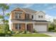 Two-story house with stone and shingle accents, a two-car garage, and landscaping at 3249 Shirecrest Ln, Dacula, GA 30019