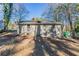 Ranch house with a spacious backyard and mature trees at 3578 Adkins Nw Rd, Atlanta, GA 30331
