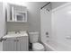 Bathroom with bathtub, toilet, sink, and mirrored cabinet at 3578 Adkins Nw Rd, Atlanta, GA 30331