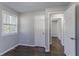 Well-lit bedroom, hardwood floors and access to another room at 3578 Adkins Nw Rd, Atlanta, GA 30331