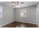 Bedroom with hardwood floors, ceiling fan, and window with blinds at 3578 Adkins Nw Rd, Atlanta, GA 30331