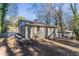 Ranch-style home with a backyard and driveway at 3578 Adkins Nw Rd, Atlanta, GA 30331
