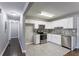 Modern kitchen with white cabinets, granite countertops, and stainless steel appliances at 3578 Adkins Nw Rd, Atlanta, GA 30331