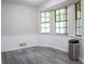 Bright dining area with large windows and wood floors at 3742 Tree Bark Ln, Snellville, GA 30039